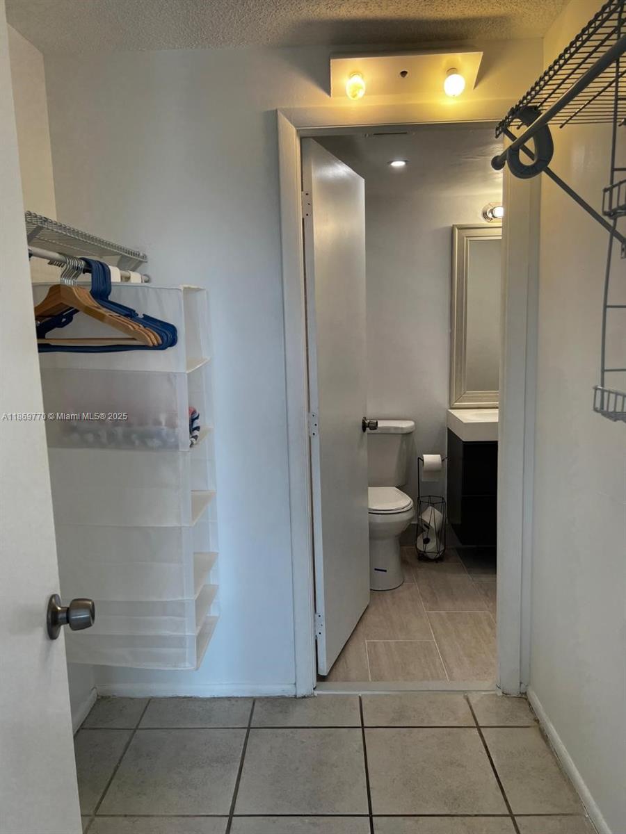4164 Inverrary Drive, Unit 510 Lauderhill, FL 33319 - Photo 17 of 21 a bathroom with a toilet and a shower