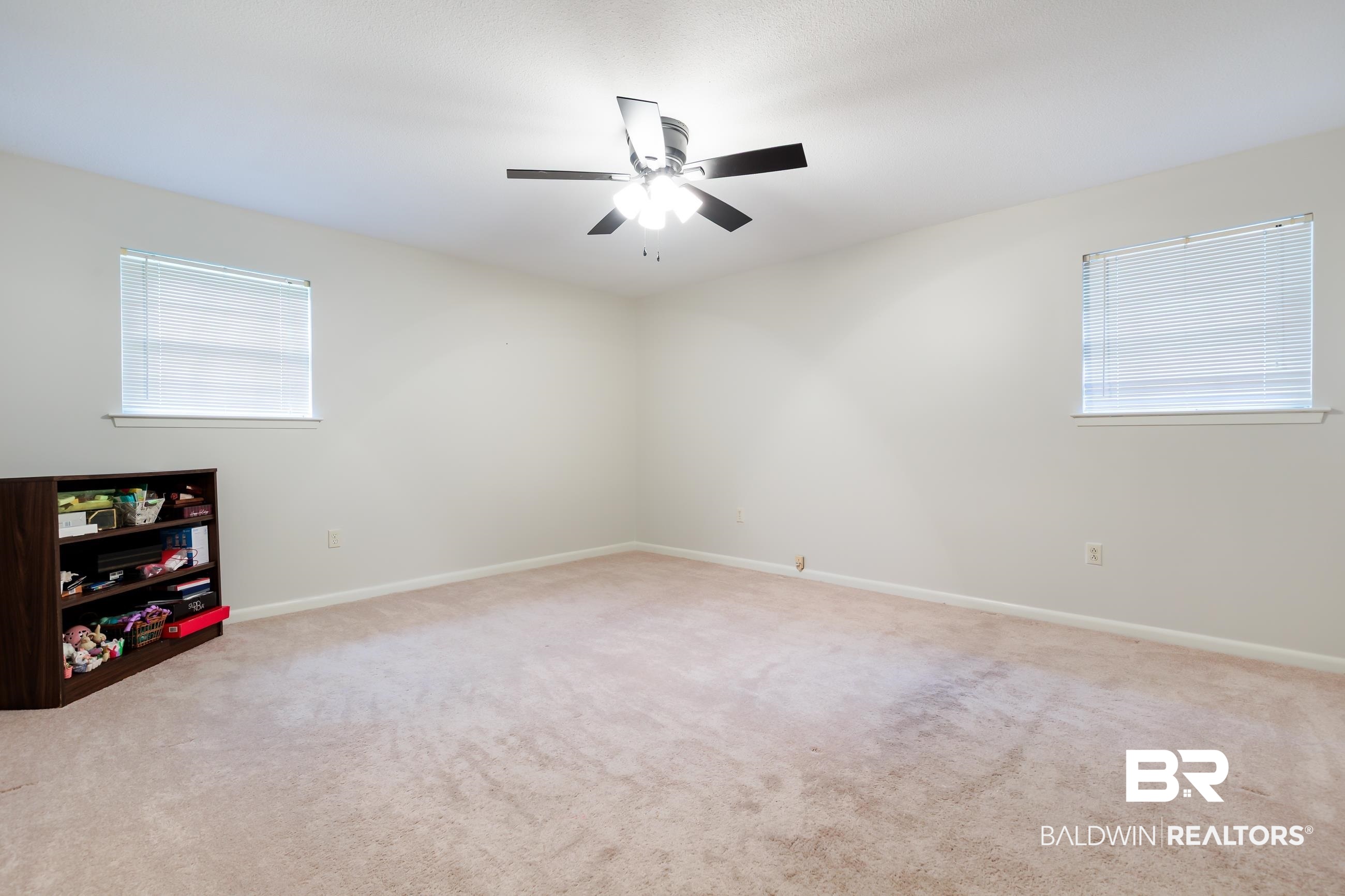1367 Spring Valley Court Mobile, AL 36693 - Photo 15 of 29 Spacious room featuring neutral carpeting and light-colored walls