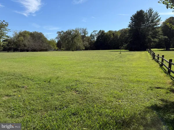 a view of a swimming pool with an outdoor space and seating area
