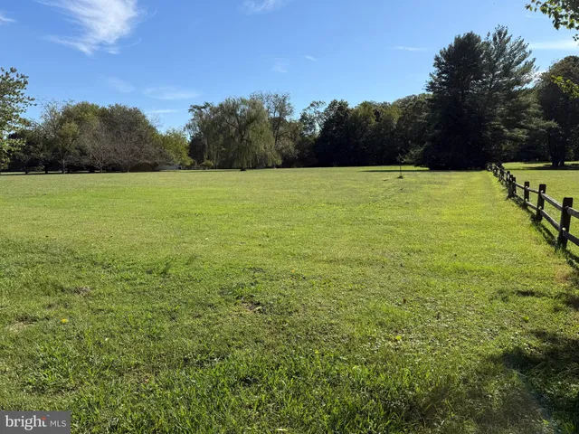 a view of a swimming pool with an outdoor space and seating area