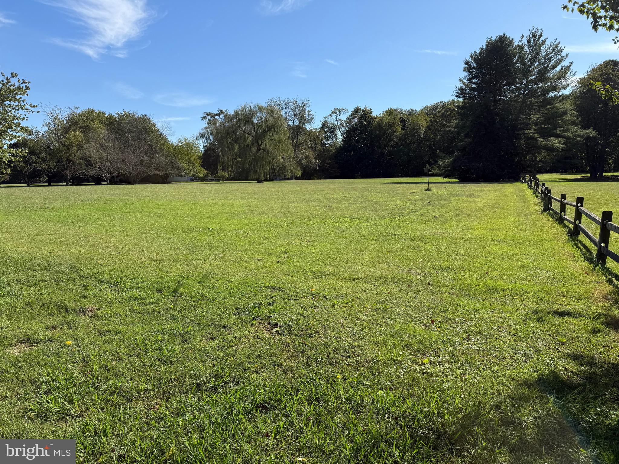915 Sportsman Neck Road Queenstown, MD 21658 - Photo 18 of 33 a view of a field with a trees in the background