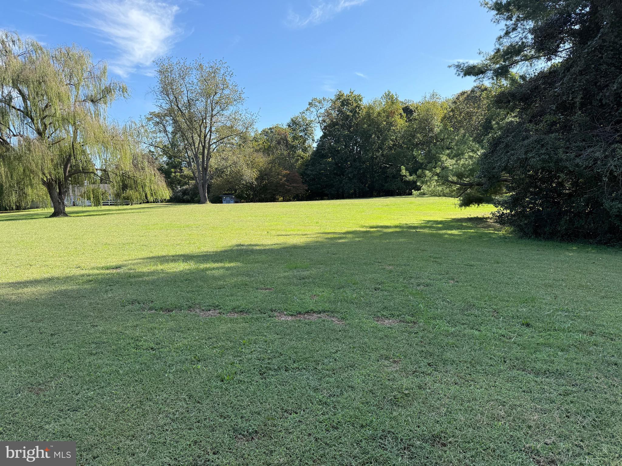915 Sportsman Neck Road Queenstown, MD 21658 - Photo 21 of 33 a view of a swimming pool with an outdoor space and seating area