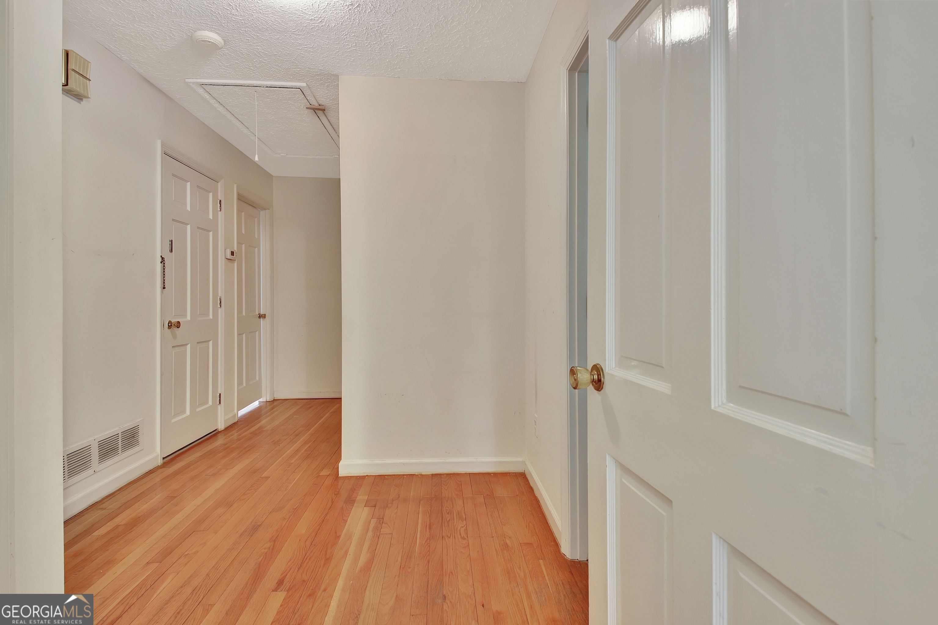 717 Tyrone Road Tyrone, GA 30290 - Photo 41 of 58 a view of a hallway with wooden floor and entryway