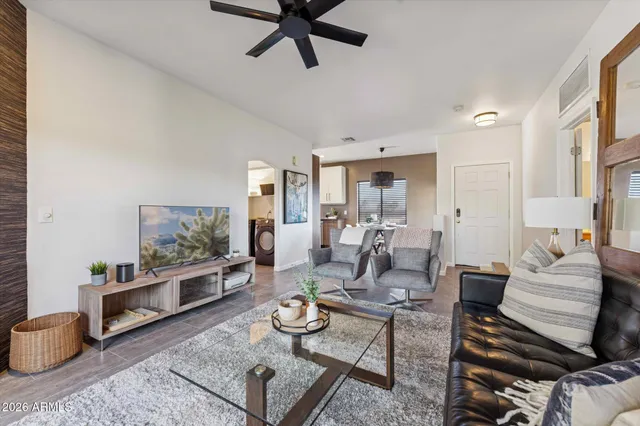 a living room with furniture and a flat screen tv