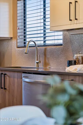 a kitchen with a sink and cabinets