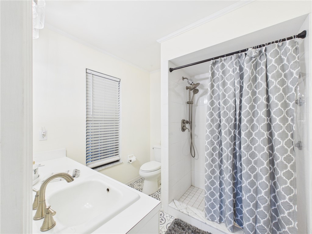 225 Midvale Terrace Sebastian, FL 32958 - Photo 17 of 25 a bathroom with a sink and a tub