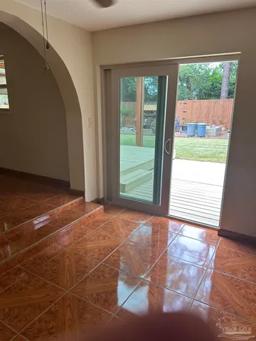 a view of a room with a large window