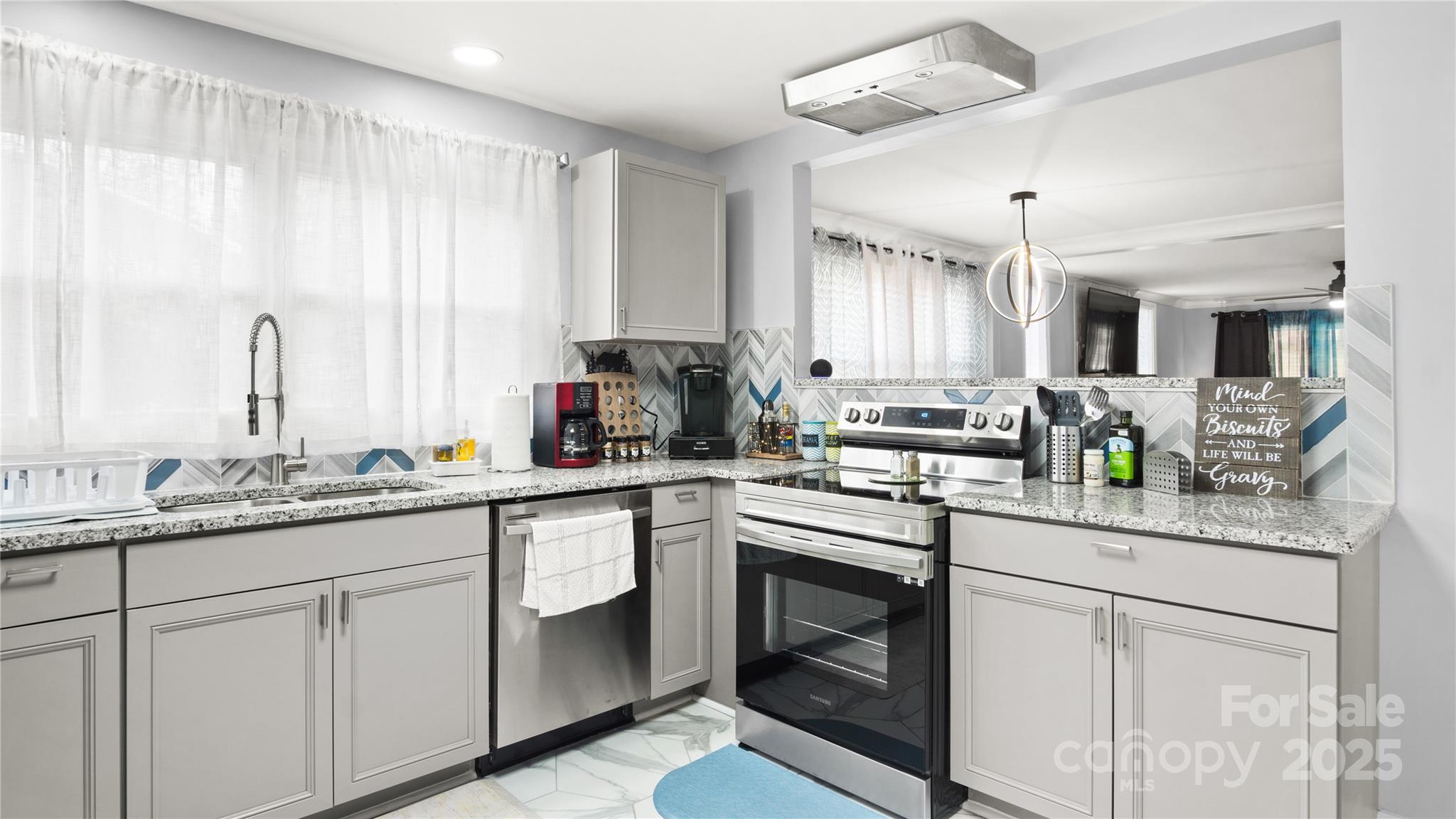 318 Lake Montonia Road Kings Mountain, NC 28086 - Photo 16 of 23 a kitchen with stainless steel appliances granite countertop a sink a stove and cabinets