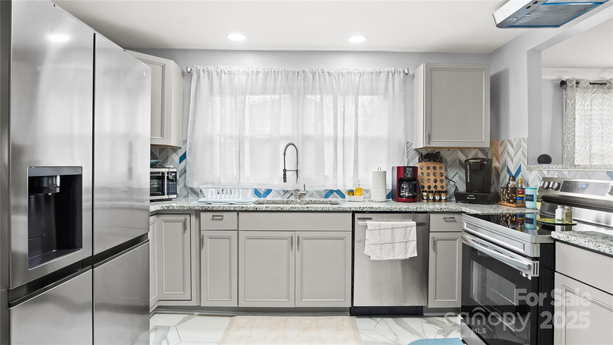 318 Lake Montonia Road Kings Mountain, NC 28086 - Photo 17 of 23 a kitchen with stainless steel appliances granite countertop a sink and cabinets