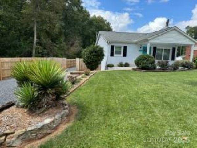318 Lake Montonia Road Kings Mountain, NC 28086 - Photo 2 of 23 a front view of a house with garden