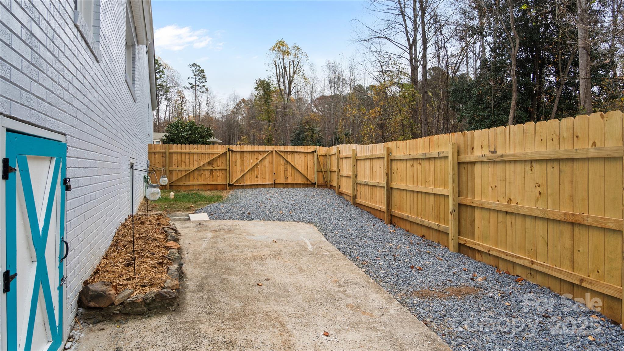 318 Lake Montonia Road Kings Mountain, NC 28086 - Photo 21 of 23 a view of backyard with wooden fence