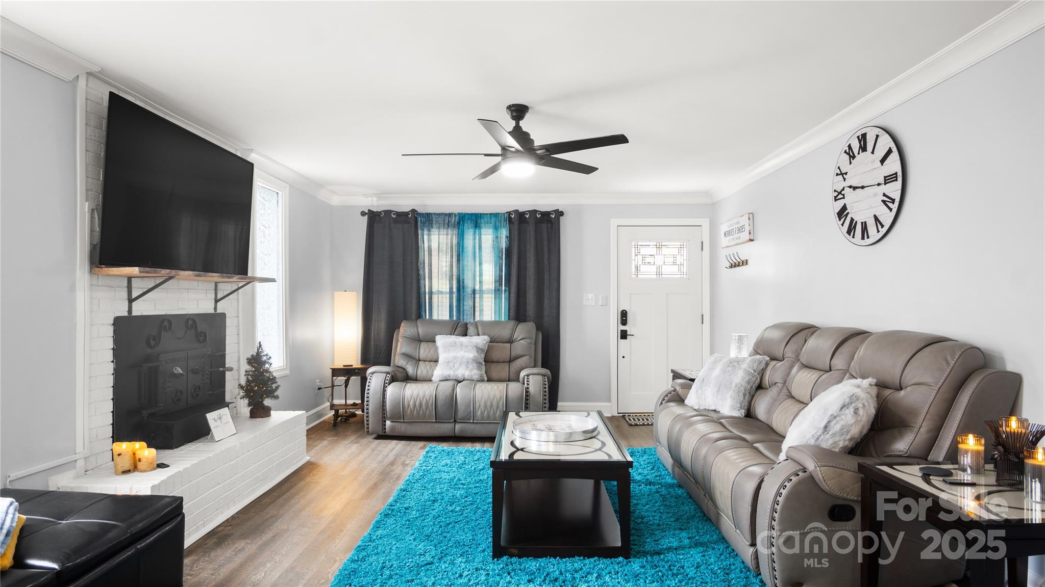 318 Lake Montonia Road Kings Mountain, NC 28086 - Photo 4 of 23 a living room with furniture fireplace and a flat screen tv