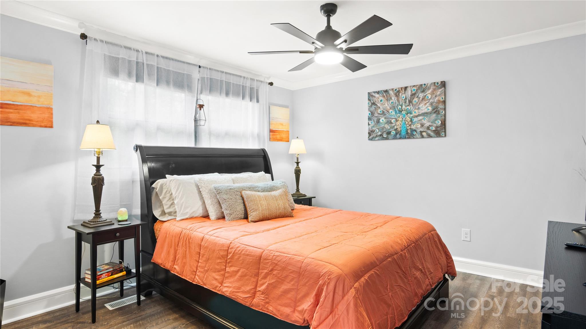 318 Lake Montonia Road Kings Mountain, NC 28086 - Photo 10 of 23 a bedroom with a large bed and a chandelier