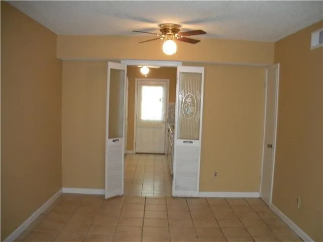 a kitchen with a stove and a refrigerator
