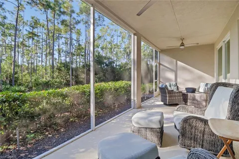 a balcony with furniture and a garden