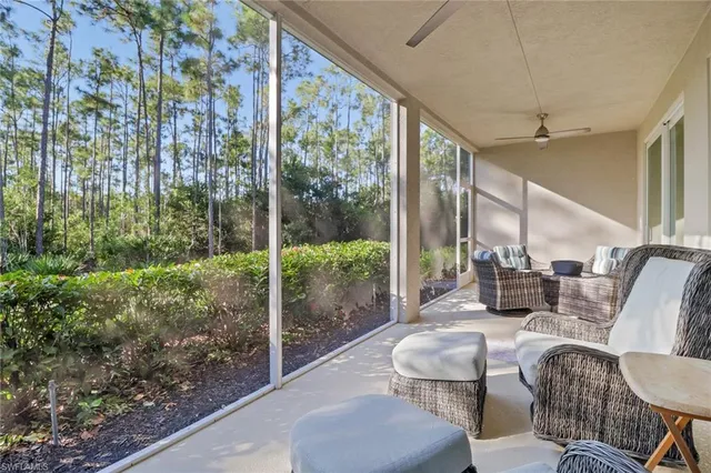 a balcony with furniture and a garden