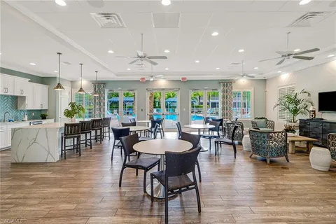 a view of a dining area with furniture window and wooden floor