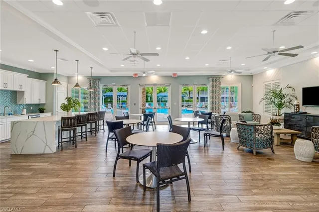 a view of a dining area with furniture window and wooden floor