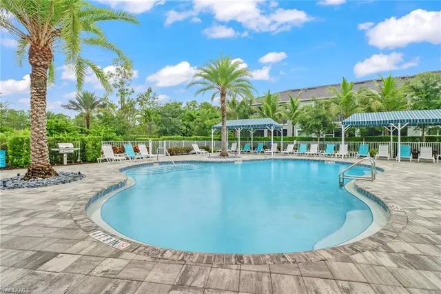 a view of a swimming pool with a patio