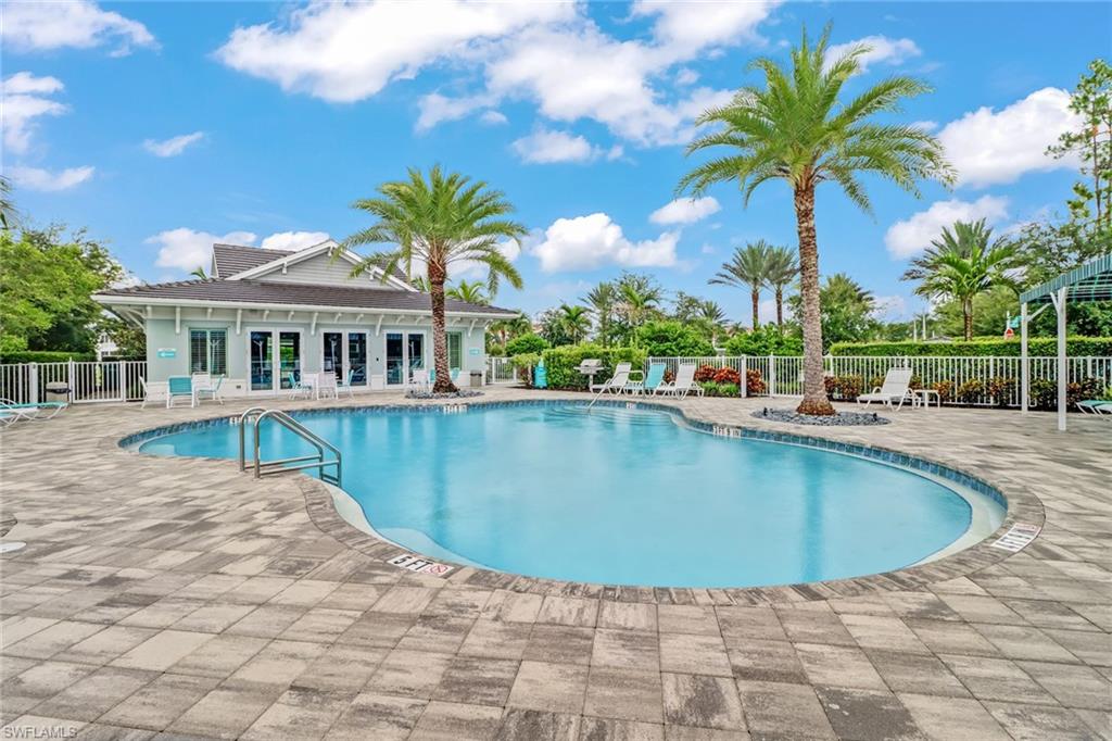 6973 Avalon Circle, Unit 1403 Naples, FL 34112 - Photo 32 of 37 Community pool featuring a patio area and french doors