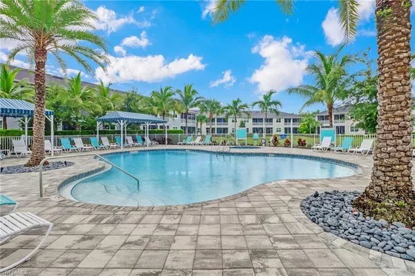 a view of a swimming pool with a patio