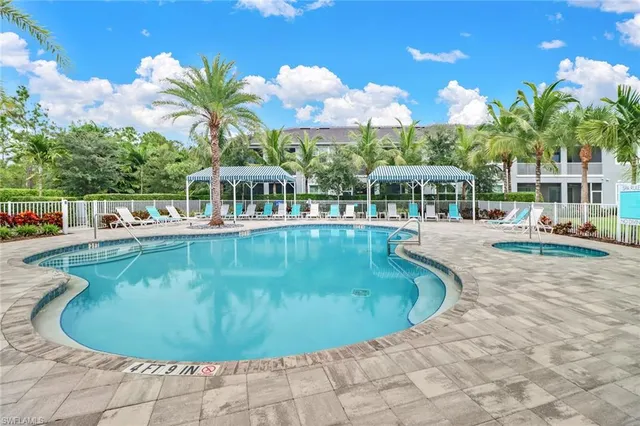 a view of a swimming pool with a patio
