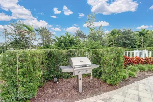 a view of a bench in backyard of the house