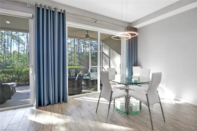 a view of a room with a furniture and floor to ceiling window