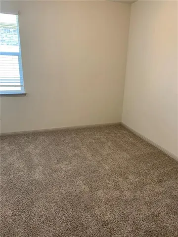 a white toilet sitting next to a bath tub