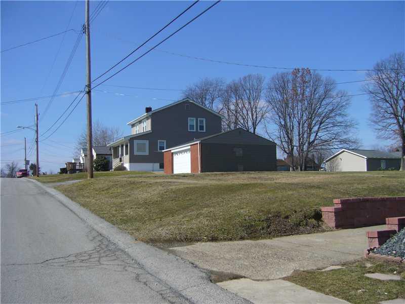 1214 Ridgeway Avenue Aliquippa, PA 15001 - Photo 16 of 17 Exterior Front. This home has 4 lots that are on 3 parcels. There is an empty lot, then house, garage and another empty lot. Great outside space beside and in back of home!