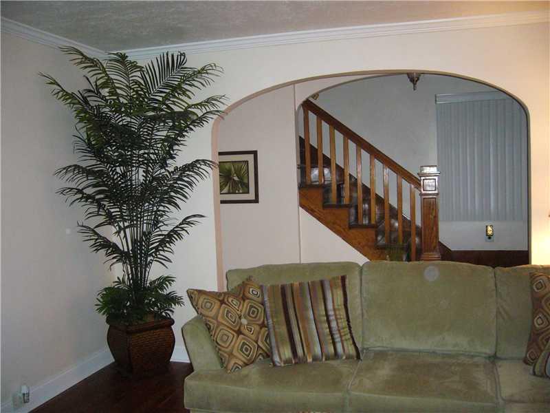1214 Ridgeway Avenue Aliquippa, PA 15001 - Photo 3 of 17 Living Room. Another view of the living room! Original staircase to upper floor.