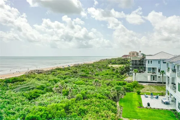 a view of city from balcony with furniture