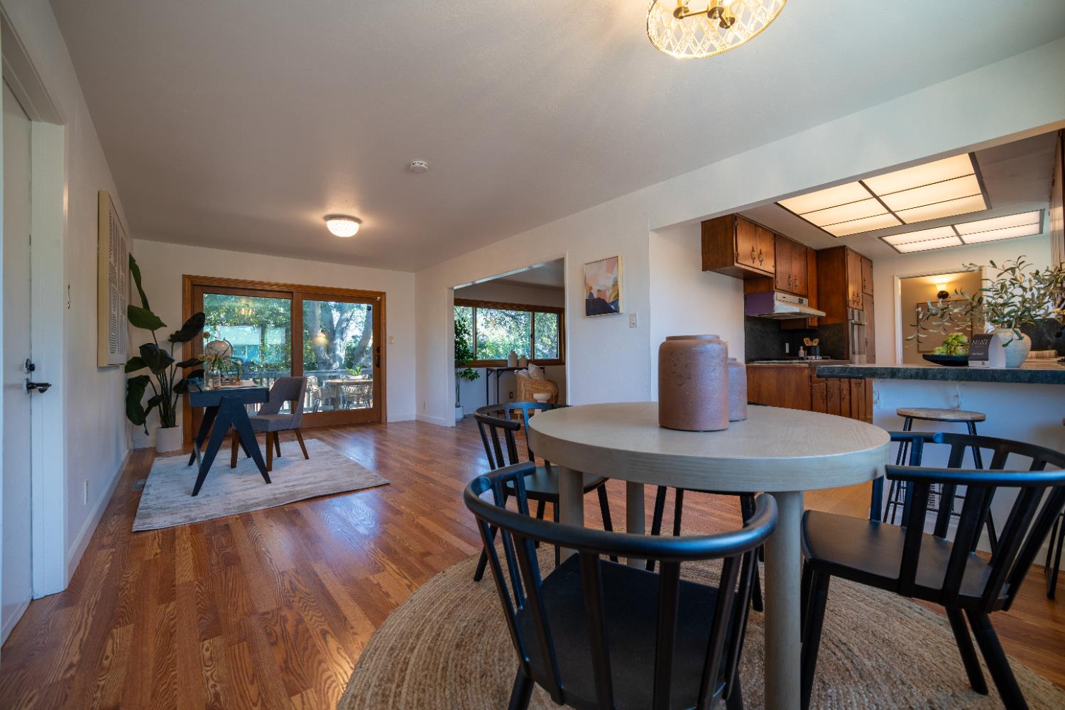 4220 Elva Way Sacramento, CA 95821 - Photo 11 of 52 a view of a dining room with furniture and wooden floor