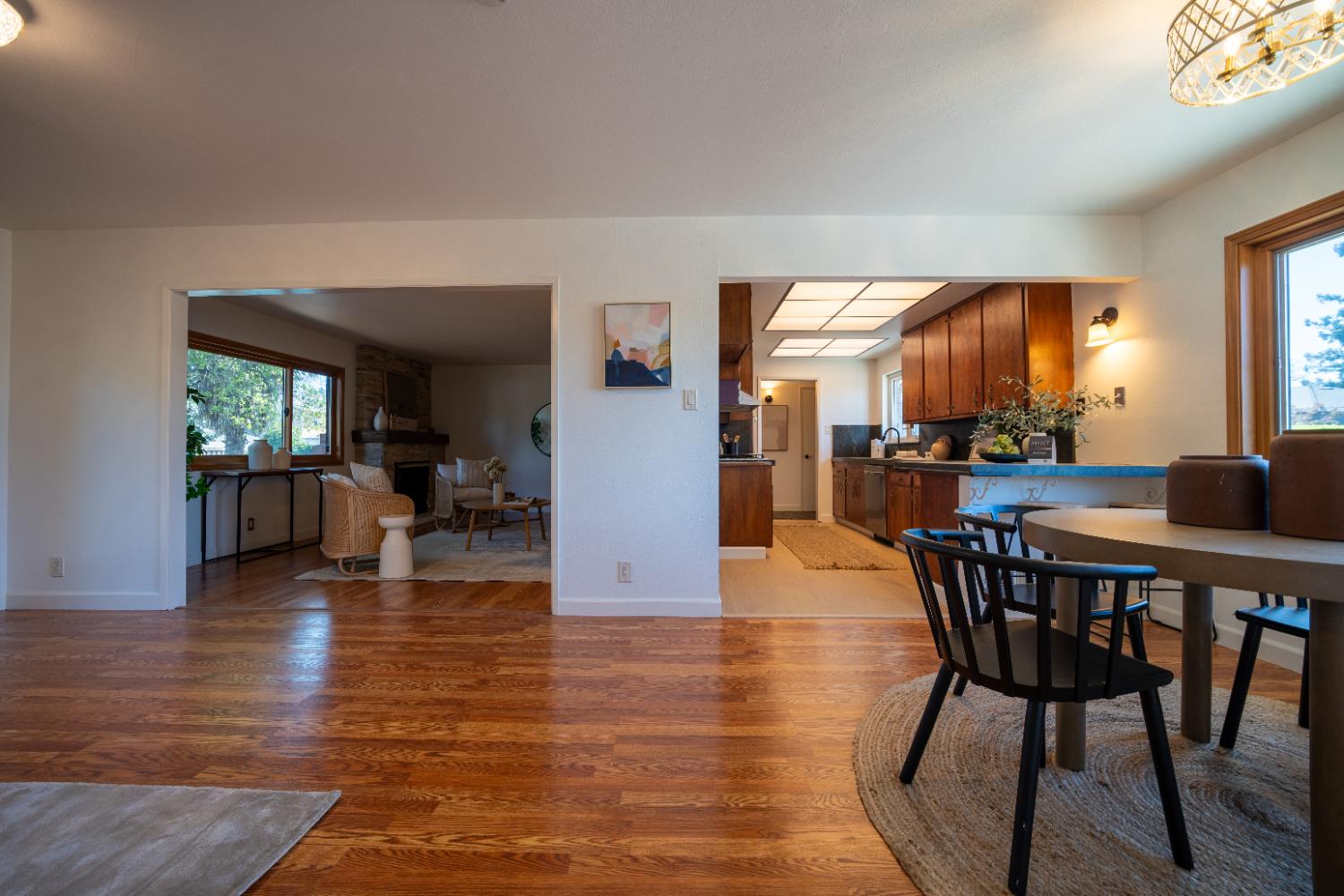 4220 Elva Way Sacramento, CA 95821 - Photo 12 of 52 a dining room with furniture window and wooden floor