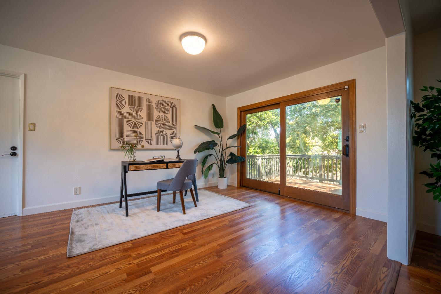 4220 Elva Way Sacramento, CA 95821 - Photo 14 of 52 a workspace with furniture window and wooden floor