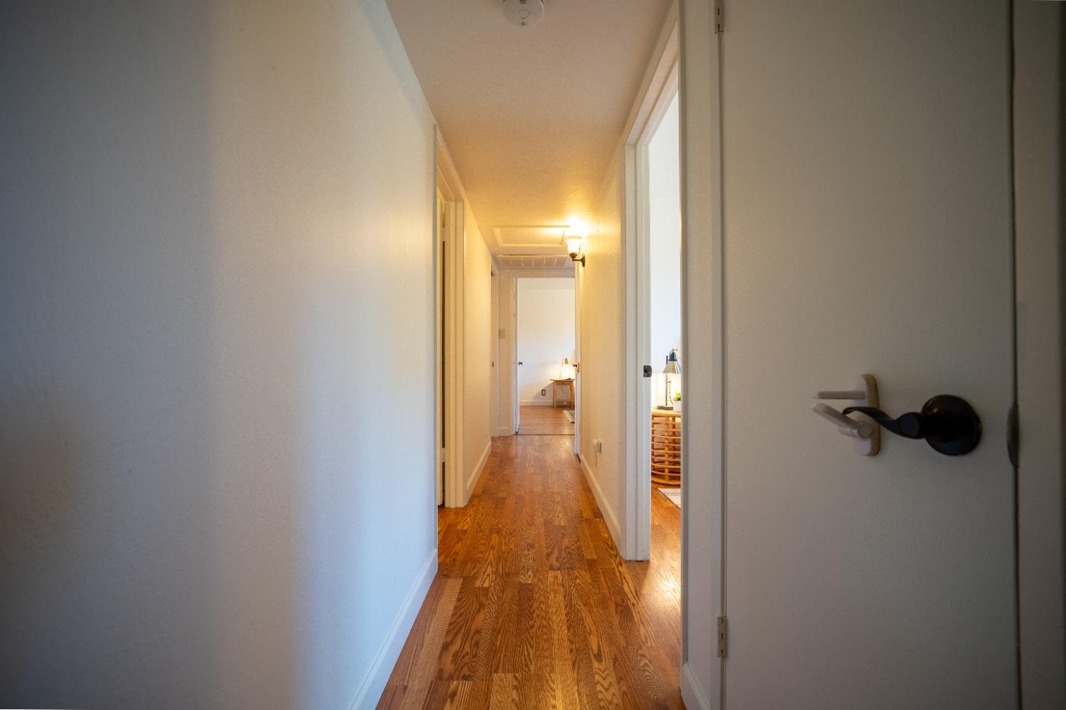 4220 Elva Way Sacramento, CA 95821 - Photo 18 of 52 a view of a hallway with wooden floor and closet