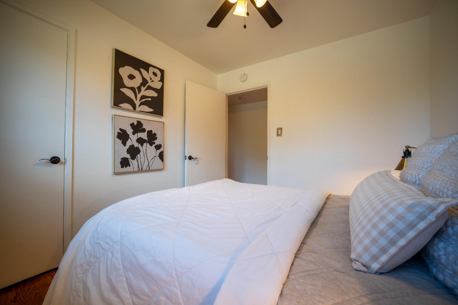 4220 Elva Way Sacramento, CA 95821 - Photo 20 of 52 a bedroom with a bed and a chandelier