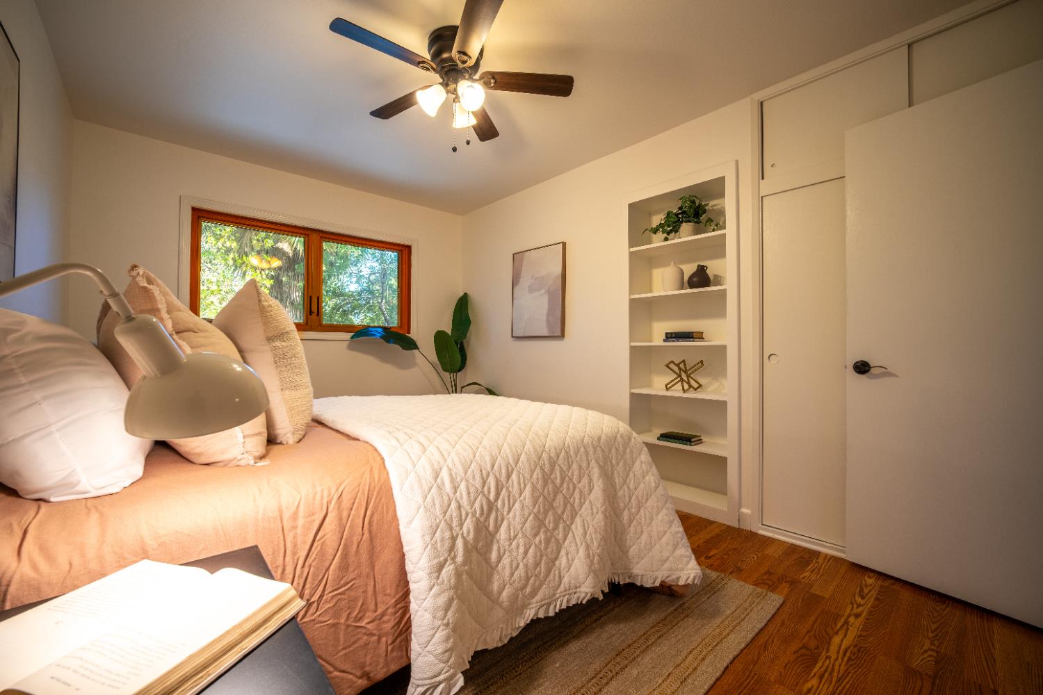 4220 Elva Way Sacramento, CA 95821 - Photo 22 of 52 a bedroom with a bed and a chandelier