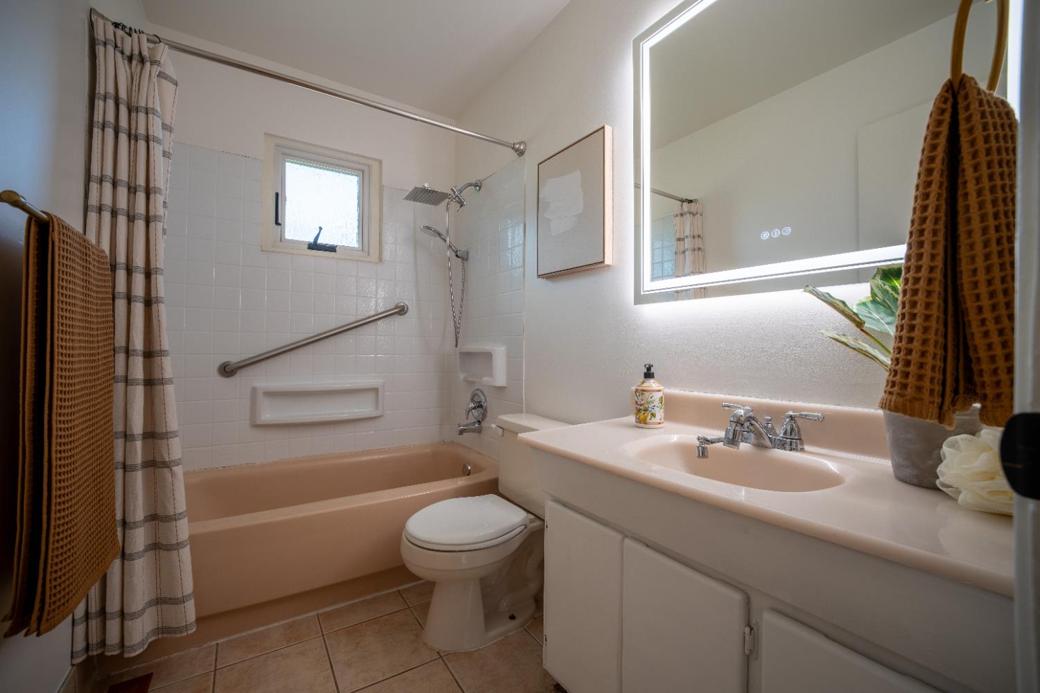 4220 Elva Way Sacramento, CA 95821 - Photo 24 of 52 a bathroom with a sink a toilet and shower