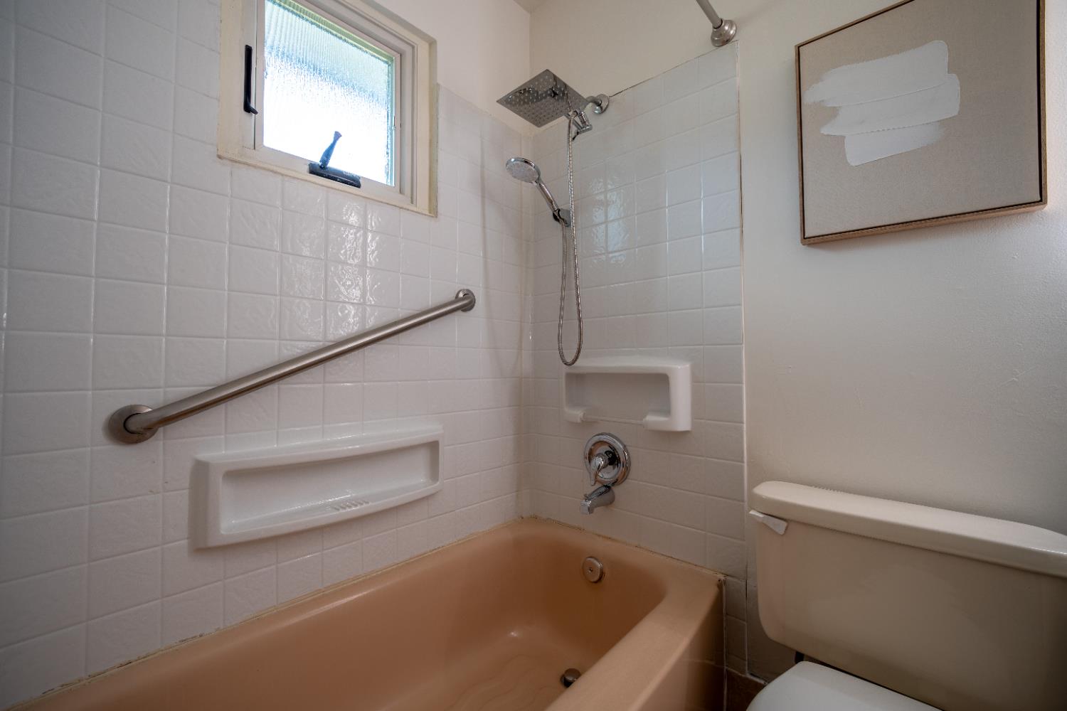 4220 Elva Way Sacramento, CA 95821 - Photo 25 of 52 a bathroom with a bathtub and toilet