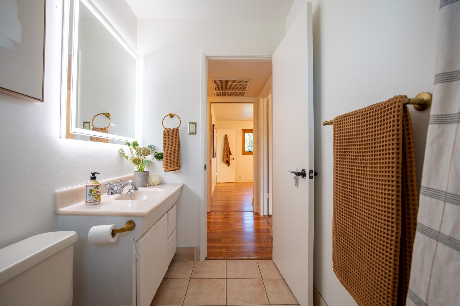 4220 Elva Way Sacramento, CA 95821 - Photo 26 of 52 a bathroom with a sink toilet and shower