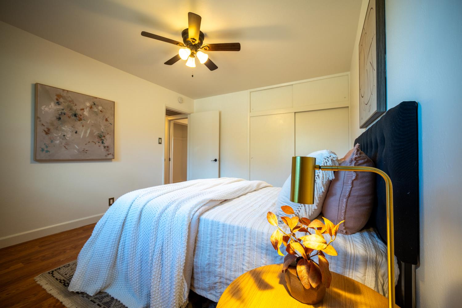 4220 Elva Way Sacramento, CA 95821 - Photo 29 of 52 a bedroom with a bed and wooden floor