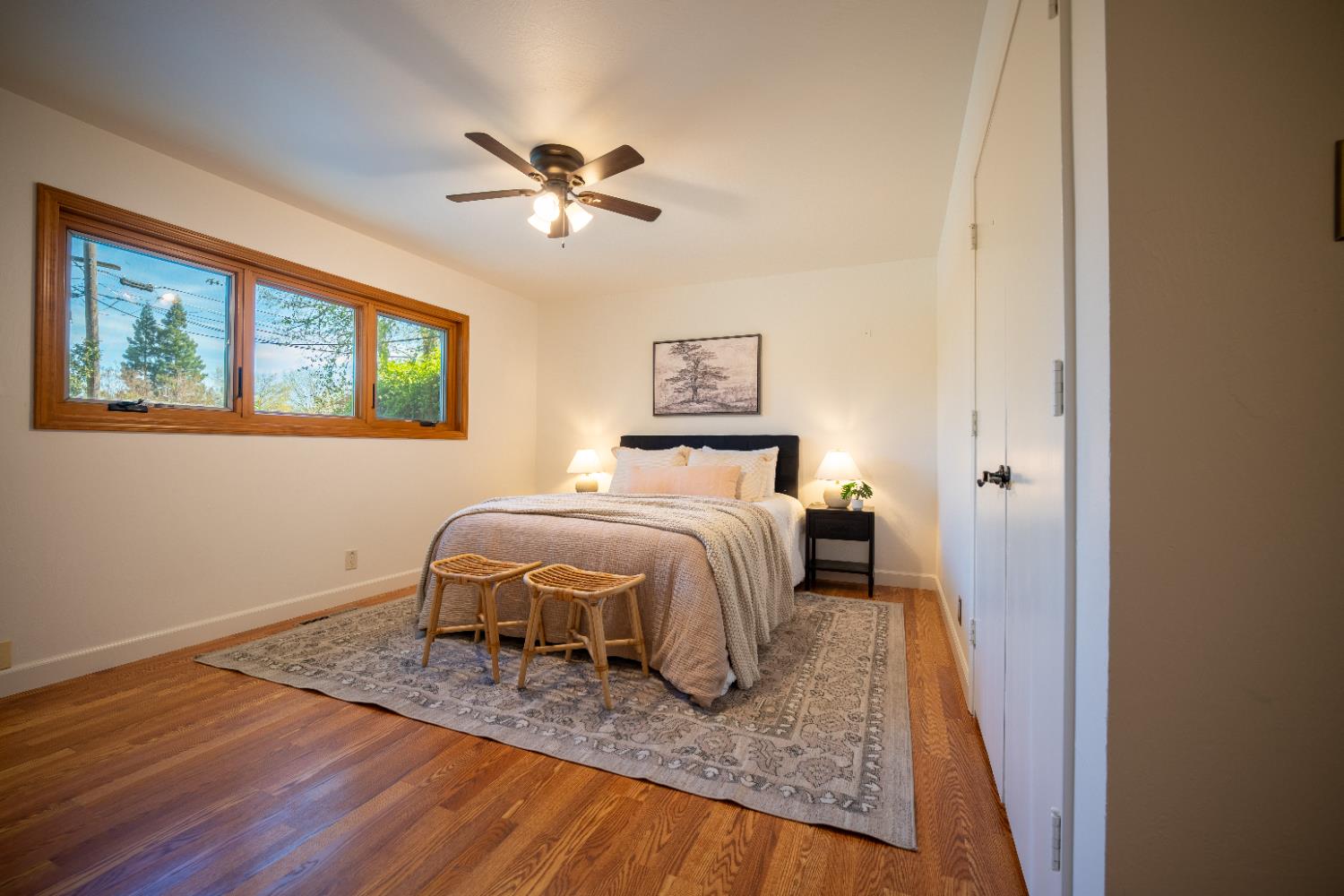 4220 Elva Way Sacramento, CA 95821 - Photo 30 of 52 a bedroom with a bed and wooden floor
