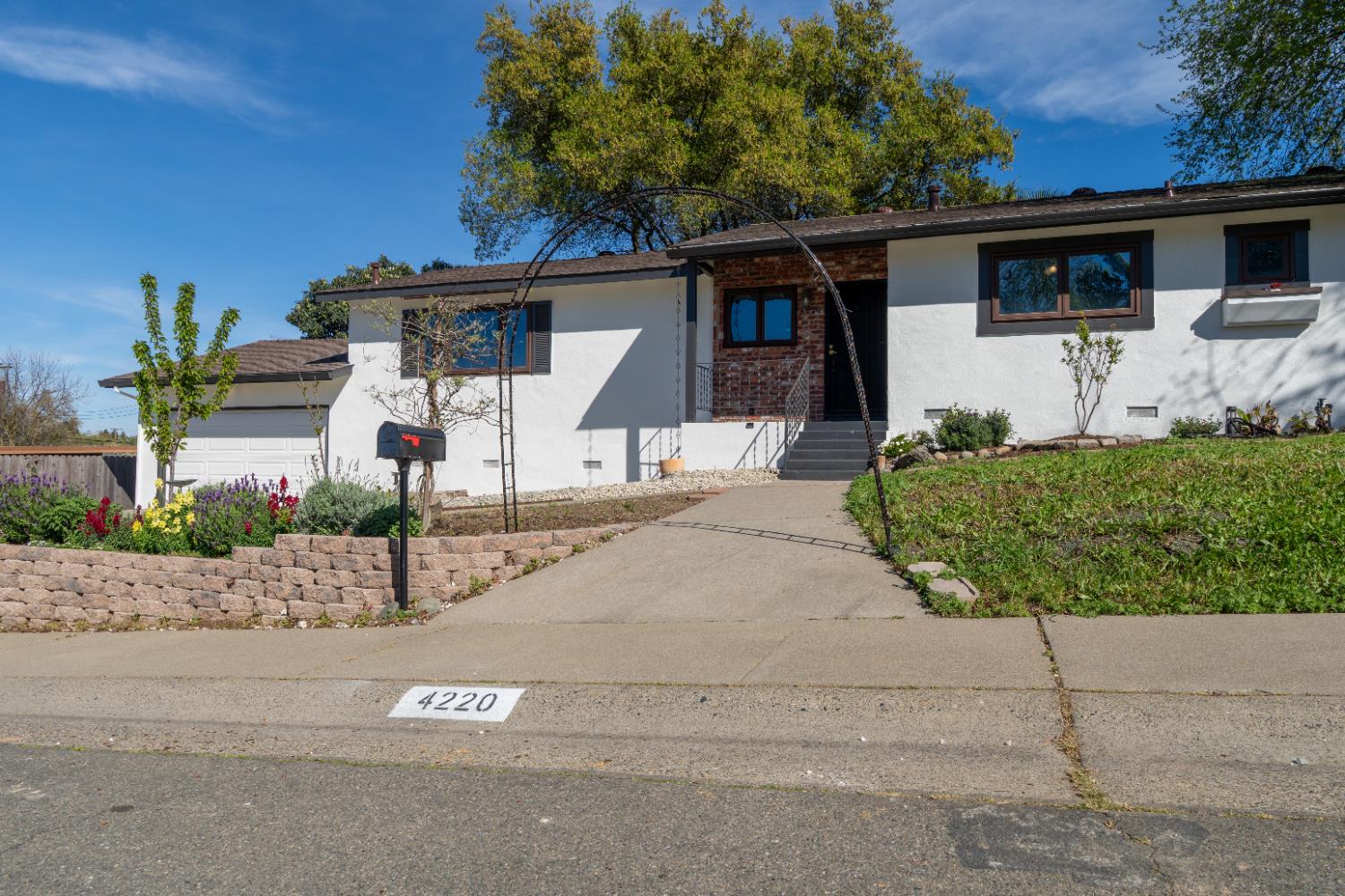 4220 Elva Way Sacramento, CA 95821 - Photo 3 of 52 front view of a house with a street