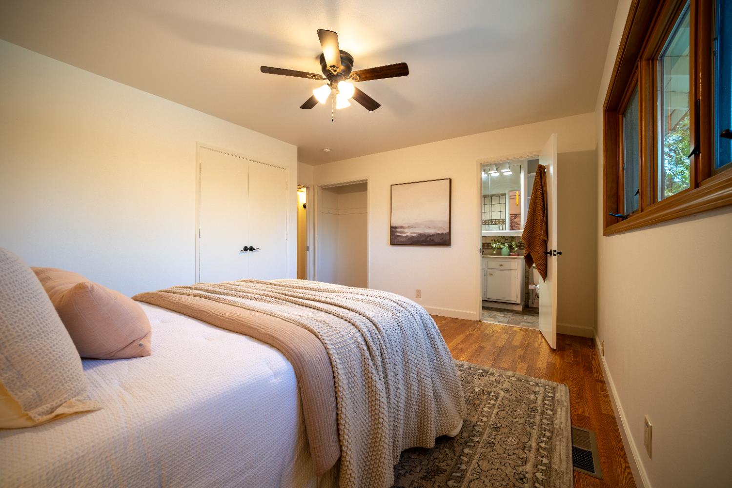 4220 Elva Way Sacramento, CA 95821 - Photo 31 of 52 a bed room with a bed and a chandelier