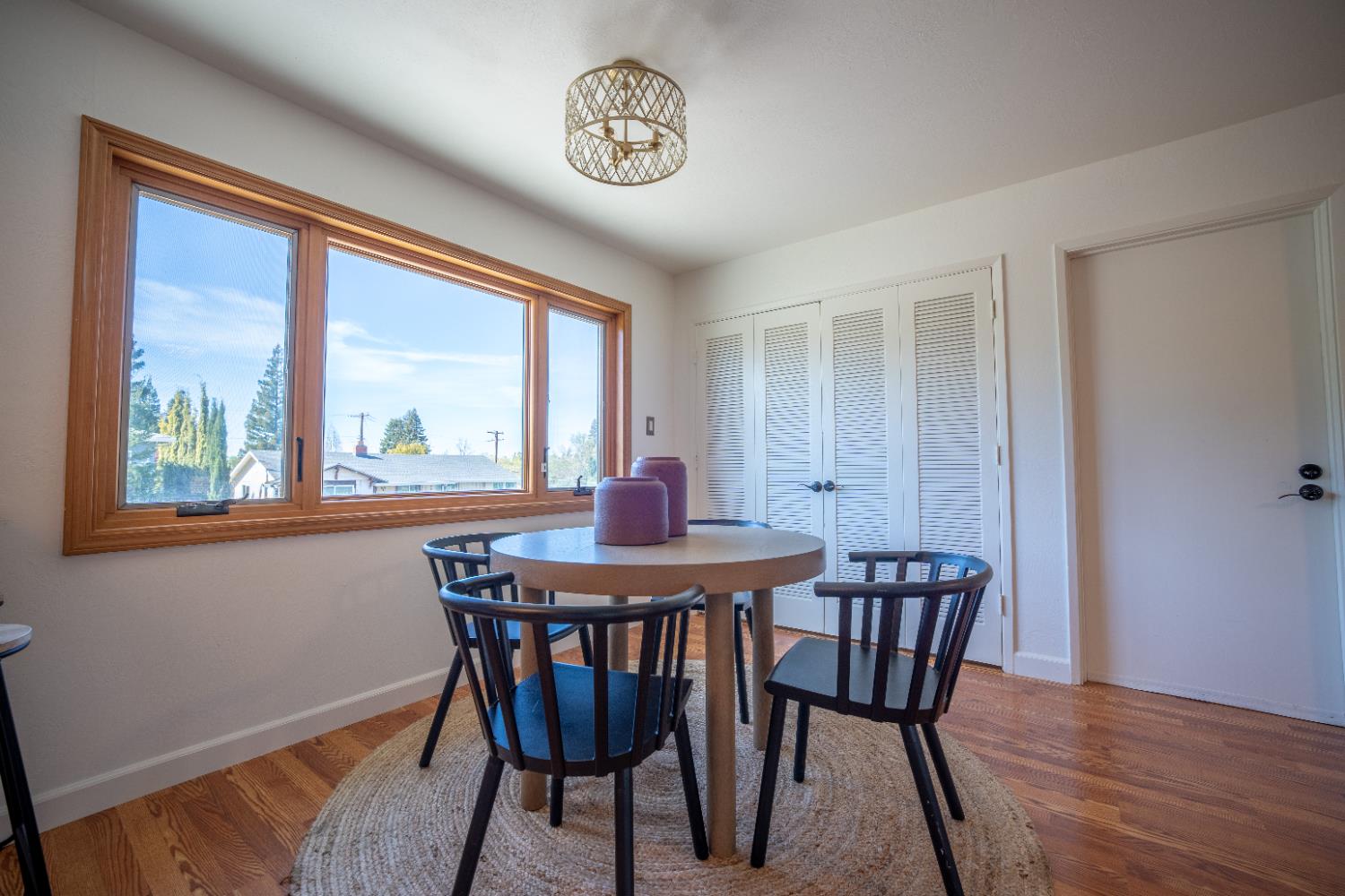 4220 Elva Way Sacramento, CA 95821 - Photo 9 of 52 a view of a dining room with furniture window and wooden floor