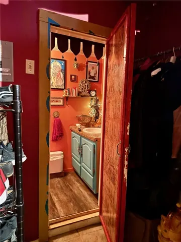 a view of outdoor dining space and dining hall with a large tree