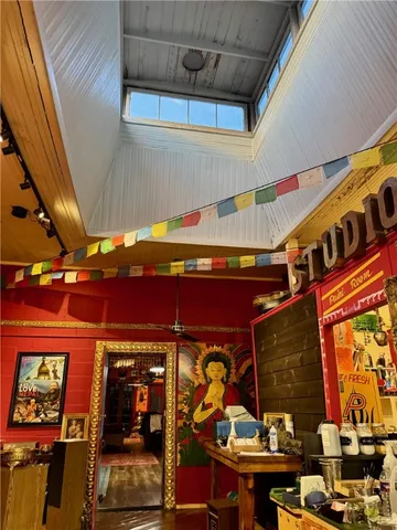 a bathroom with a granite countertop sink and a toilet