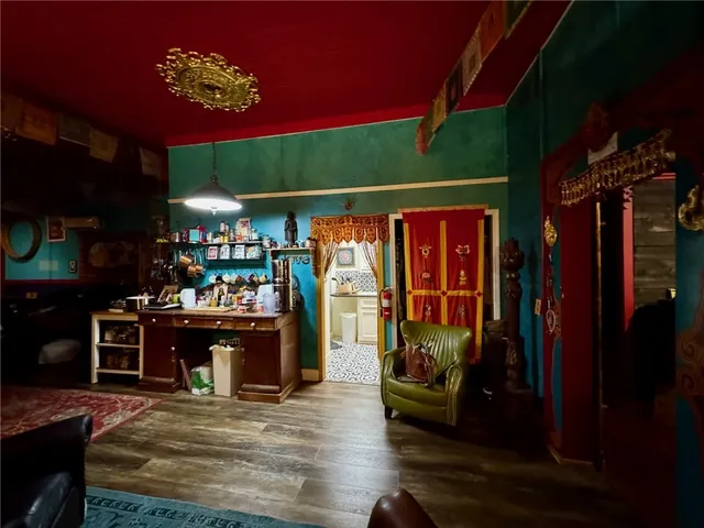 a view of a patio with table and chairs with wooden floor