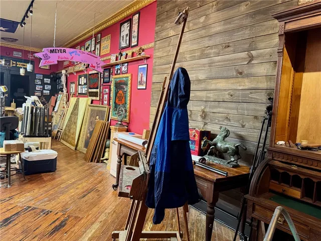 a living room with lots of furniture and a rug